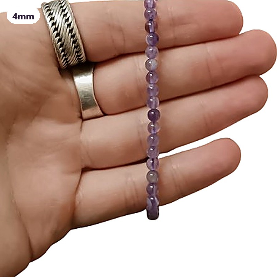 4mm Crystal bead bracelets in a hand