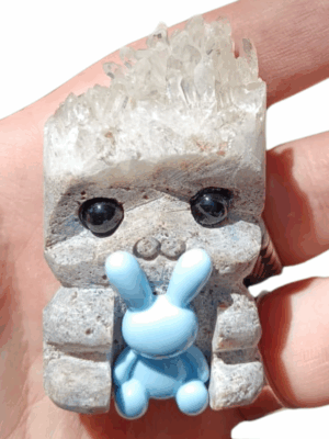 Crystal Buddy holding something